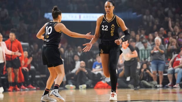 Las Vegas Aces forward Aja Wilson celebrates with guard Kelsey Plum.